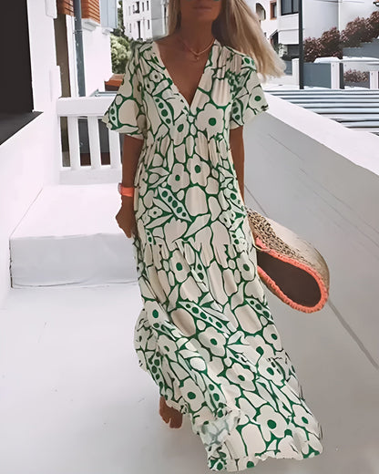 KIONA | Lange Zomerjurk met Vloeiende Snit en Elegante Grafische Motief